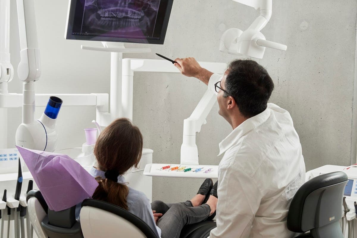 A dentist reviewing a scan with a patient at Marloe Dental